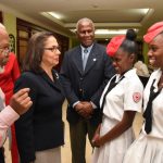 Minister of Labour and Social Security, Hon. Shahine Robinson (second left); Chairman, Jamaica Red Cross 70th Anniversary Committee, Silvera Castro (left); and President, Jamaica Red Cross, Dr. Dennis Edwards (centre), interact with students of Bridgeport High School, Kadian Smith (second right) and Natasha Morrison, during the media launch of the Jamaica Red Cross 70th Anniversary celebration, at The Knutsford Court Hotel in New Kingston on February 16.