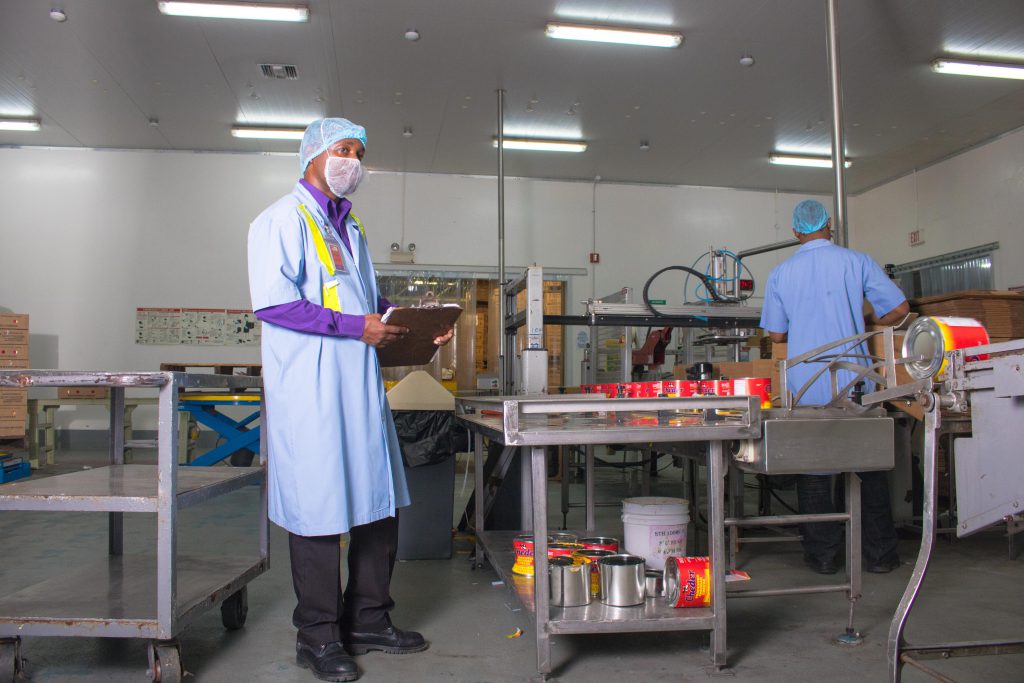 An Inspector from the Occupational Safety and Health Department carrying out factory inspections at Dairy Industries Jamaica Limited